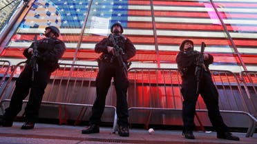  In this Nov. 14, 2015 file photo, heavily armed New York city police officers with the Strategic Response Group stand guard at the armed forces recruiting center in New York's Times Square. (AP)