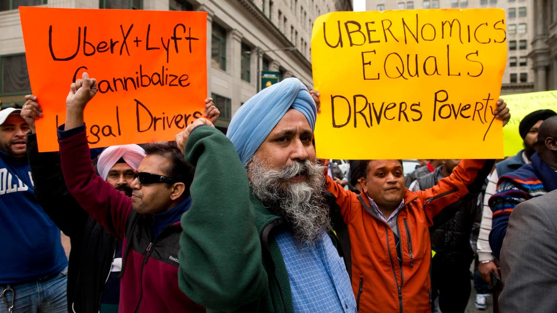 Taxi and Uber's black car service drivers protest the ride-hailing services Uber X and Lyft Wednesday, Dec. 16, 2015, in Philadelphia. (AP)