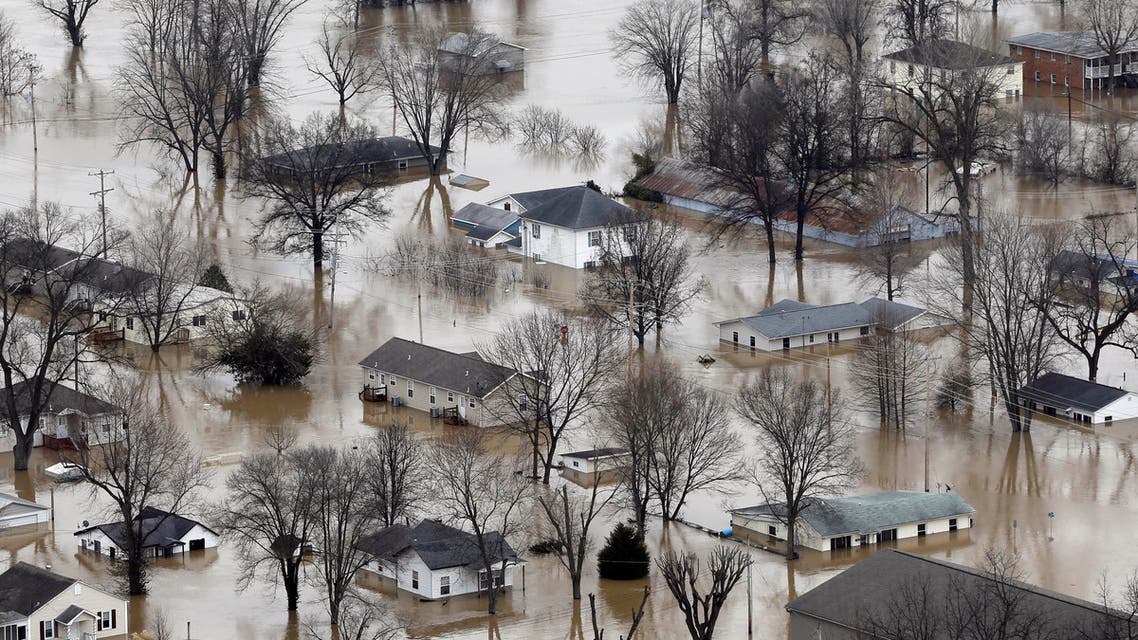In this aerial photo, homes are surrounded by floodwater, Wednesday, Dec. 30, 2015, in Pacific, Mo. (AP)