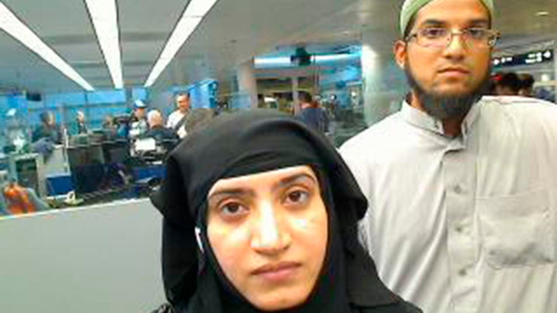 Tashfeen Malik, (L), and Syed Farook are pictured passing through Chicago's O'Hare International Airport in this July 27, 2014 handout photo obtained by Reuters December 8, 2015.