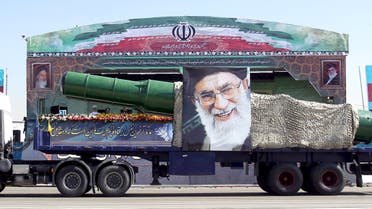 A military truck carrying a missile and a picture of Iran's Supreme Leader Ayatollah Ali Khamenei is seen during a parade marking the anniversary of the Iran-Iraq war (1980-88) in Tehran, in this September 22, 2015 file photo. President Barack Obama's administration is preparing new sanctions on international companies and individuals over Iran's ballistic missile programne, sources familiar with the situation said on December 30, 2015. REUTERS/Raheb Homavandi/TIMA/FilesATTENTION EDITORS - THIS PICTURE WAS PROVIDED BY A THIRD PARTY. REUTERS IS UNABLE TO INDEPENDENTLY VERIFY THE AUTHENTICITY, CONTENT, LOCATION OR DATE OF THIS IMAGE. FOR EDITORIAL USE ONLY. NOT FOR SALE FOR MARKETING OR ADVERTISING CAMPAIGNS. NO THIRD PARTY SALES. NOT FOR USE BY REUTERS THIRD PARTY DISTRIBUTORS. THIS PICTURE IS DISTRIBUTED EXACTLY AS RECEIVED BY REUTERS, AS A SERVICE TO CLIENTS