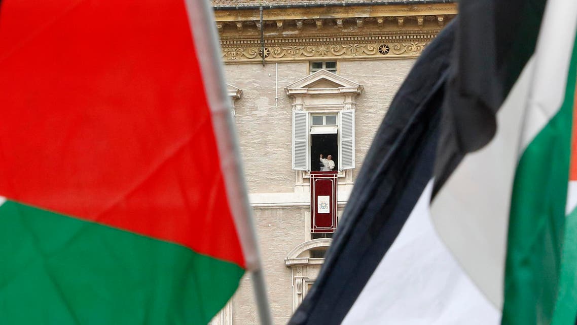 pro Palestine demonstrators wave flags as Pope Francis celebrates the Angelus noon prayer from his studio window overlooking St. Peter's square at the Vatican, Sunday, Aug. 3, 2014. (AP)