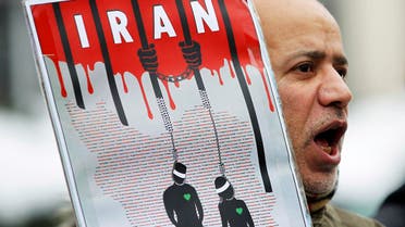 An Iranian exile shouts slogans to protest against executions in Iran during a demonstration in front of the Iranian embassy in Brussels December 29, 2010. (Reuters)