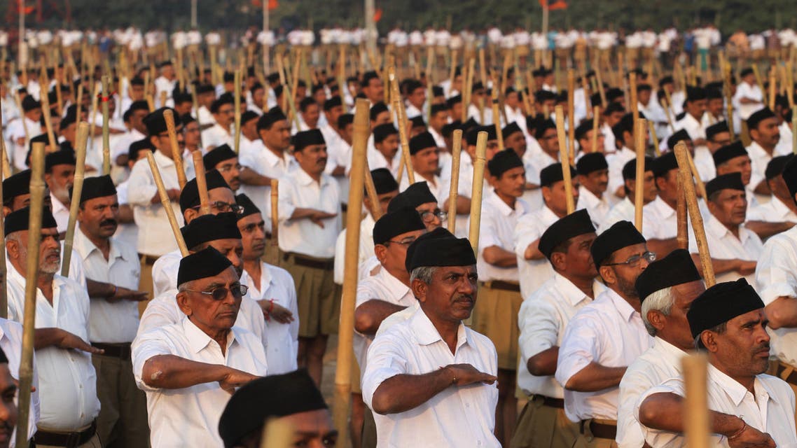 Volunteers of the militant Hindu group Rashtriya Swayamsevak Sangh (RSS) participate in a three-day workers camp on the outskirts of Ahmadabad, India, Saturday, Jan. 3, 2015. The RSS, parent organization of the ruling Bharatiya Janata Party, combines religious education with self-defense exercises. The organization has long been accused of stoking religious hatred against Muslims. (AP Photo/Ajit Solanki)