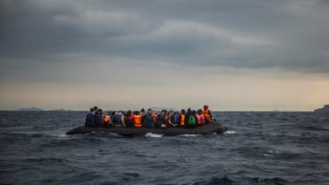  Refugees and migrants onboard a dinghy approach the Greek island of Lesbos, after crossing the Aegean sea from Turkey, Saturday, Jan. 2, 2016. More than a million people reached Europe in 2015 in the continent's largest refugee influx since the end of World War II. Nearly 3,800 people are estimated to have drowned in the Mediterranean last year, making the journey to Greece or Italy in unseaworthy vessels packed far beyond capacity. (AP Photo/Santi Palacios)