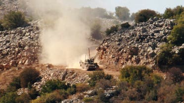  An Israeli army tank patrols during an investigation by the U.N. peacekeepers and Lebanese army soldiers near the site where Hezbollah attacked on Tuesday an Israeli patrol, in the hills of Kfar Shouba village, near the Israeli-occupied Shebaa farms, southern Lebanon, on Wednesday Oct. 8, 2014. Israel fired toward Hezbollah positions in southern Lebanon on Tuesday after the Shiite guerrillas set off an explosion along the tense border that wounded at least two Israeli soldiers, in the most serious incident between the two countries in months. Hezbollah issued a statement on the group’s Al Manar TV station claiming responsibility for the blast in Shebaa on Tuesday, saying it targeted an Israeli patrol. (AP Photo/Lutfallah Daher)