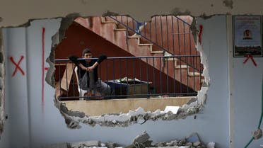 A relative looks at the demolished house of Palestinian Bahaa Mohammed Halil Allyan in the Arab east Jerusalem neighbourhood of Jabel Mukaber January 4, 2016. A spokesperson for the Israeli army said on Monday that security personnel demolished the house of Palestinian Bahaa Mohammed Halil Allyan and sealed off the house of Allah Daud Ali Abu Jamal in Jabel Mukaber. The spokesperson added that on October 13, 2015 Allyan and a second assailant shot and stabbed passengers riding a public bus killing three Jews, and Jamal killed one Jewish man in a car ramming and stabbing attack in Jerusalem. REUTERS/Ammar Awad