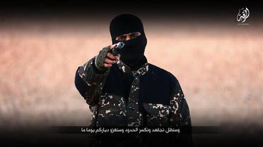An image grab taken from a video published by media branch of Islamic State group on January 3, 2016, purportedly shows an English-speaking IS fighter speaking at an undisclosed location before executing five men from the Syrian city of Raqqa. (AFP)