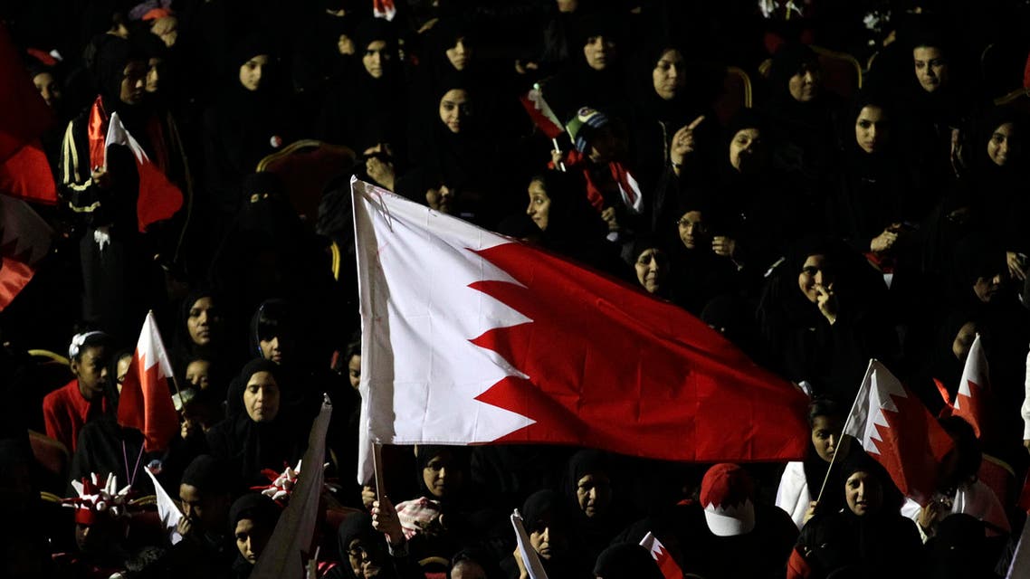 Bahraini pro-government protesters shout slogans during a march supporting the Bahraini leadership in Manama, Bahrain, Monday, Feb. 21, 2011. (AP Photo/Hassan Ammar)