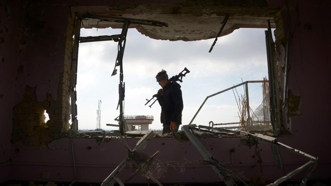 An Afghan policeman inspects a building used by insurgents to launch an attack on the Indian consulate, in Mazar-i-Sharif on January 5, 2016. A 25-hour gun and bomb siege near the Indian consulate in the Afghan city of Mazar-i-Sharif ended late January 4, after all the attackers were killed, officials said. AFP PHOTO / Farshad Usyan / AFP / FARSHAD USYAN