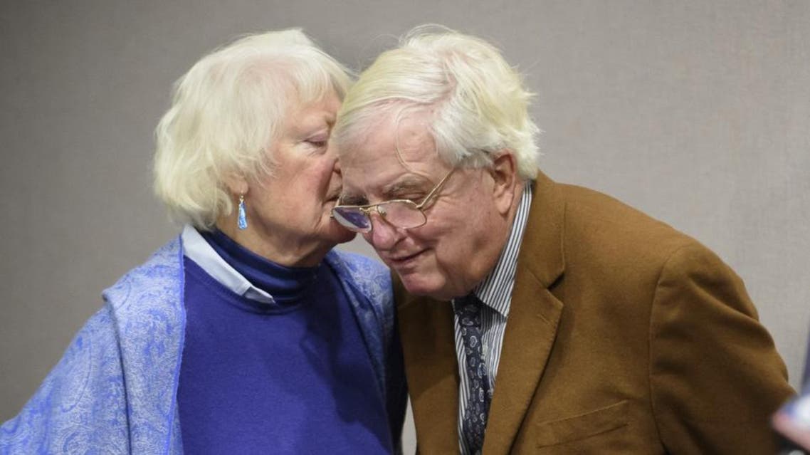 Ellen Kennedy whispers to her husband, Moorhead Kennedy, 85, who was one of 53 American hostages held 444 days at the United States Embassy in Iran from 1979 to 1981. (AP)