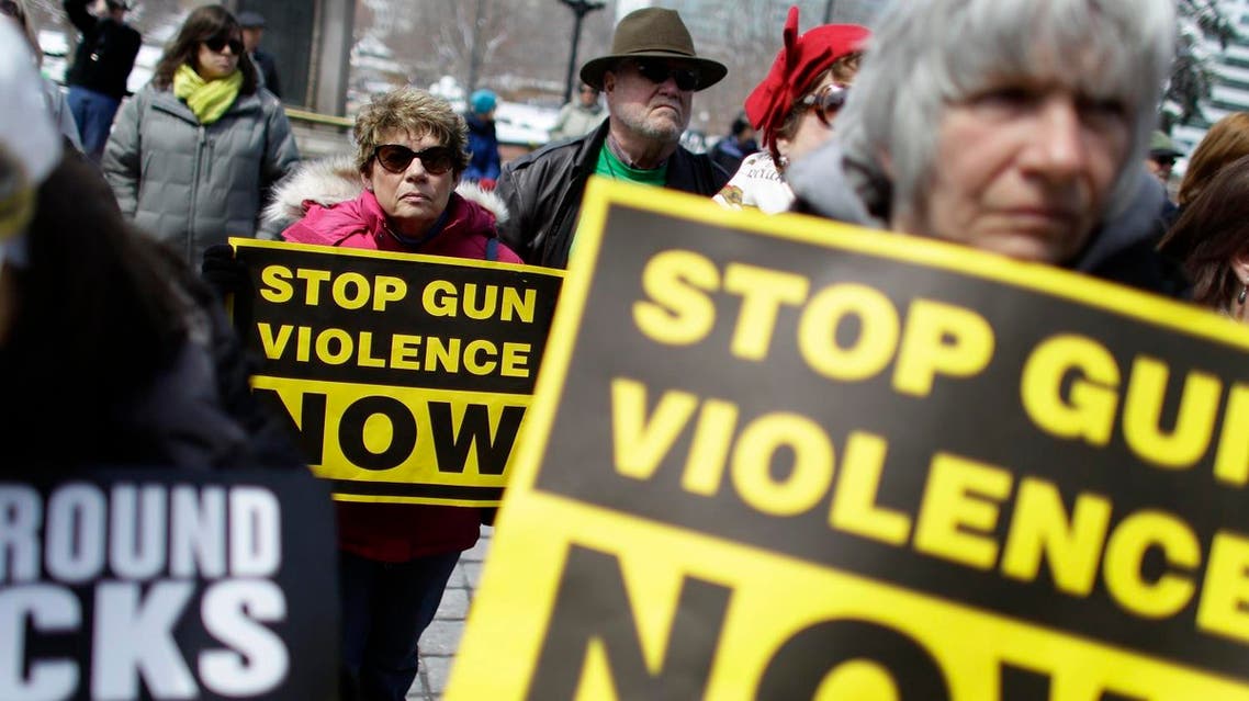 Community gun safety advocates and members of the public hold signs during a rally and vigil to honor victims of gun violence on the steps of the Colorado State Capitol, in Denver. (File photo: AP)