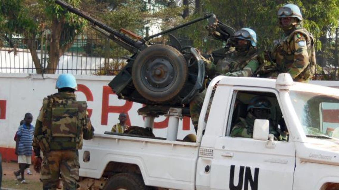 U.N. peacekeepers take a break as they patrol along a street during the presidential election in Bangui, the capital of Central African Republic, December 30, 2015. (Reuters)