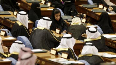 Saudi women and men, members of the Saudi Shura Council, attend a session chaired by Saudi Arabia's King Salman, in Riyadh December 23, 2015. (Reuters)