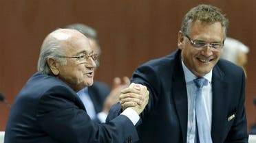 FIFA President Sepp Blatter (L) and Jerome Valcke, Secretary General of the FIFA do a Handshake For Peace at the 65th FIFA Congress in Zurich, Switzerland, in this May 29, 2015 | Reuters