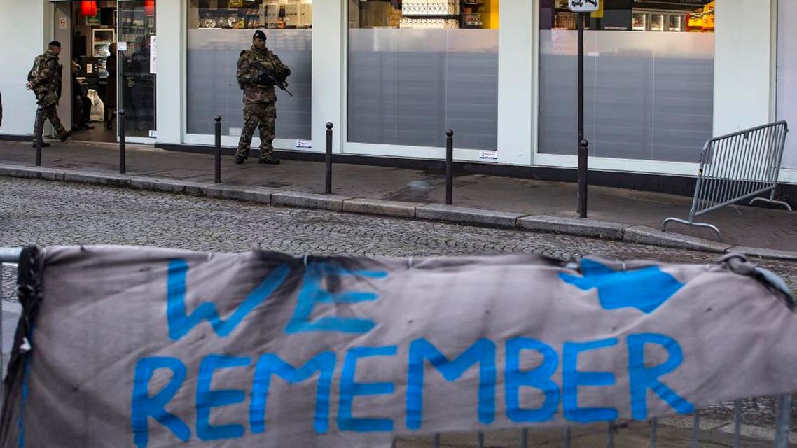 A French soldier patrols after French President Francois Hollande attended a ceremony to pay tribute to the victims of last year's January attacks outside the kosher supermarket in Paris, Tuesday, Jan. 5 2016. Hollande has honored 17 victims killed in Islamic extremist attacks on satirical newspaper Charlie Hebdo, a kosher market and police a year ago this week, unveiling plaques around Paris marking violence that ushered in a tumultuous year. (Ian Langsdon, Pool Photo via AP)