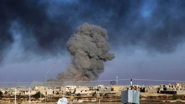 In this Friday, Dec. 25, 2015 photo, smoke rises from Islamic State positions following a U.S.-led coalition airstrike as Iraqi Security forces advance their position in downtown Ramadi. (AP)