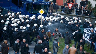 German police spray anti-migrant protesters