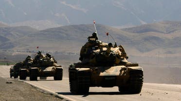 Turkish army tanks are seen near the Turkish-Iraqi border town of Silopi in the Sirnak province, southeastern Turkey, Friday, Feb. 22, 2008. AP