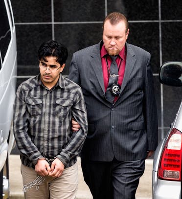 Omar Faraj Saeed Al Hardan, left, is escorted by U.S. Marshals from the Bob Casey Federal Courthouse on Friday, Jan. 8, 2016, in Houston. (AP)