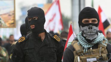  Masked Shiite militiamen attend a demonstration calling for the immediate withdrawal of Turkish troops from northern Iraq, in Basra, southern Iraq, Saturday, Dec. 12, 2015. An outpouring of public anger over the Turkish troops crisis that erupted earlier this month was on display at Saturday’s protests in Basra and the capital, Baghdad. Turkey has had troops near Mosul since last year but the arrival of additional troops last week sparked an uproar. (AP Photo/Nabil al-Jurani)
