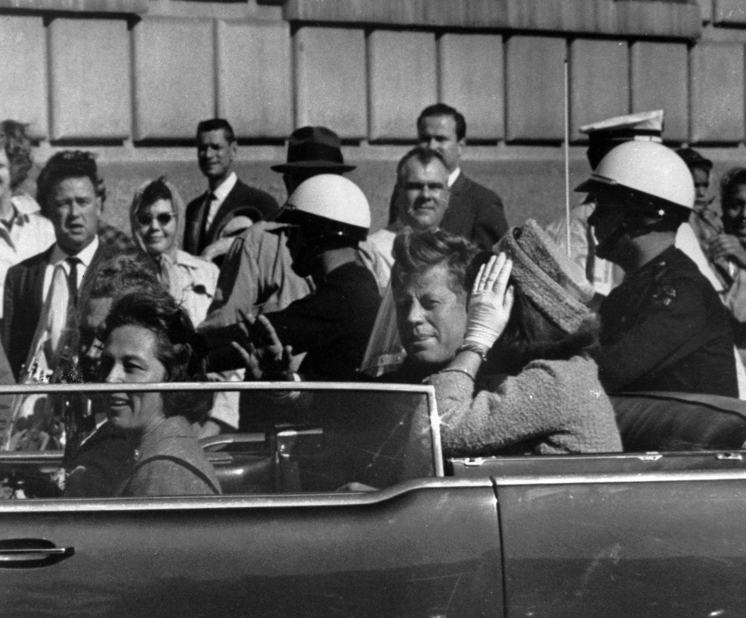 President John F. Kennedy is seen riding in motorcade approximately one minute before he was shot in Dallas, Tx., on Nov. 22, 1963. (File photo: AP)