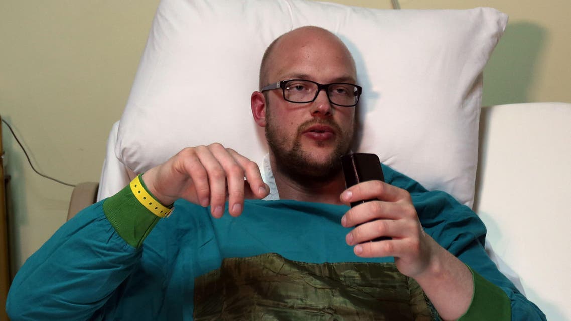 Sam Eric, a 27-year-old tourist from Sweden recovers in bed at the Nile hospital in Egypt's Red Sea resort of Hurghada on January 9, 2016 after he was injured in an attack the previous day at the Bella Vista Hotel by knife-wielding assailants, in the latest blow to the country's beleaguered tourism industry. AFP