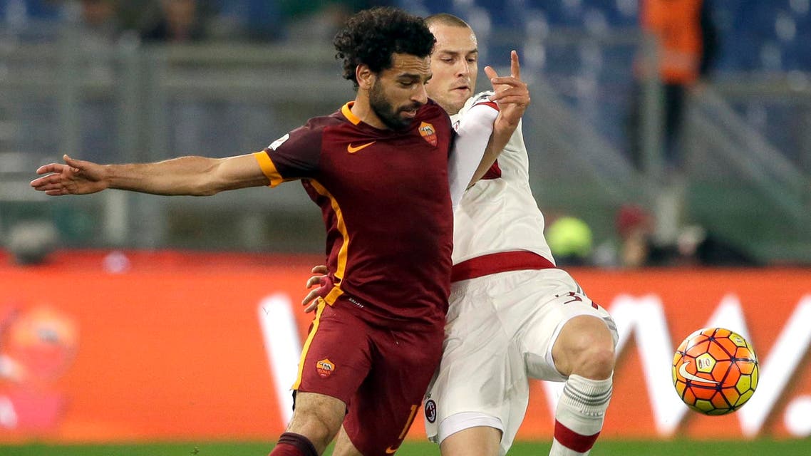 Roma’s Mohamed Salah, left, and AC Milan’s Luca Antonelli vie for the ball during an Italian Serie A soccer match between Roma and AC Milan at Rome's Olympic stadium, Saturday, Jan. 9, 2016. (AP