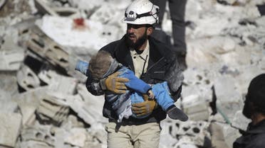 A civil defence member carries a dead child in a site hit by what activists said were airstrikes carried out by the Russian air force in the rebel-controlled area of Maaret al-Numan town in Idlib province, Syria January 9, 2016. Reuters