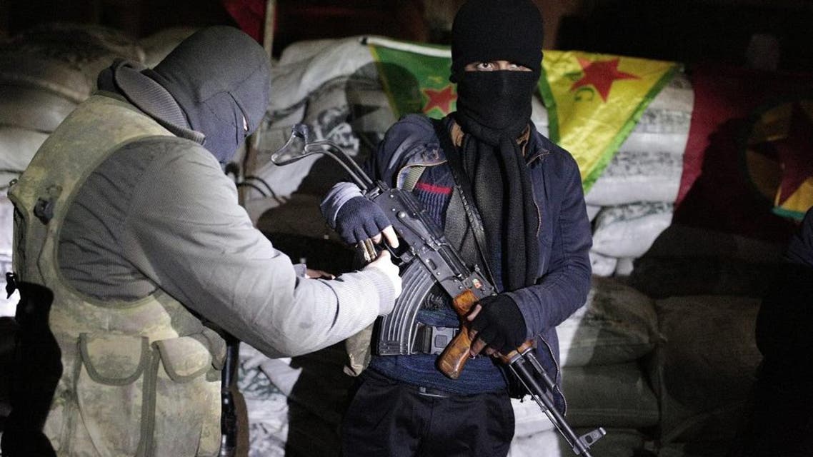 The militants of the Kurdistan Workers' Party, or PKK, stand at a barricade in Sirnak, Turkey, late Wednesday, Dec. 23, 2015. Security forces have killed 183 Kurdish rebels in a week in southeast Turkey, news agencies reported. The government imposed curfews in the mainly Kurdish towns of Cizre, Silopi, Nusaybin and Sur district of Diyarbakir as the security forces battle militants linked to the PKK who have moved their fight for autonomy to some towns and city neighborhoods in southeastern Turkey. (AP Photo/Cagdas Erdogan)