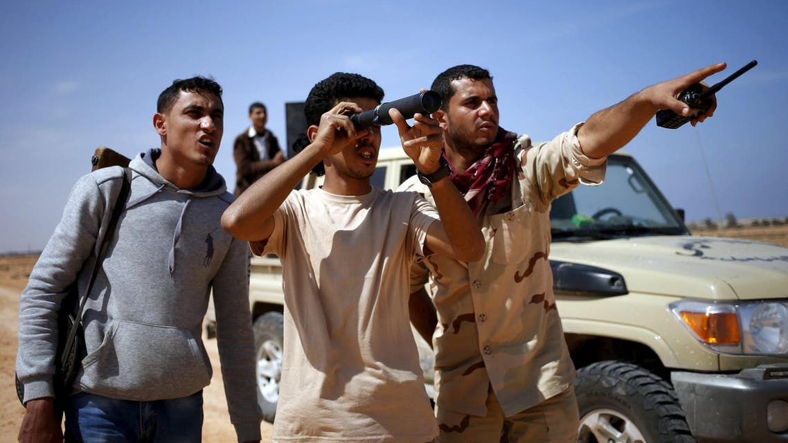 Libya Dawn fighters look at ISIS militant positions near Sirte March 19, 2015. (Reuters)