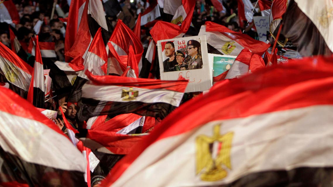 Supporters of Egypt's army chief General Abdel Fattah al-Sisi hold a poster of Sisi in Tahrir square in Cairo, on the third anniversary of Egypt's uprising, January 25, 2014. (Reuters)