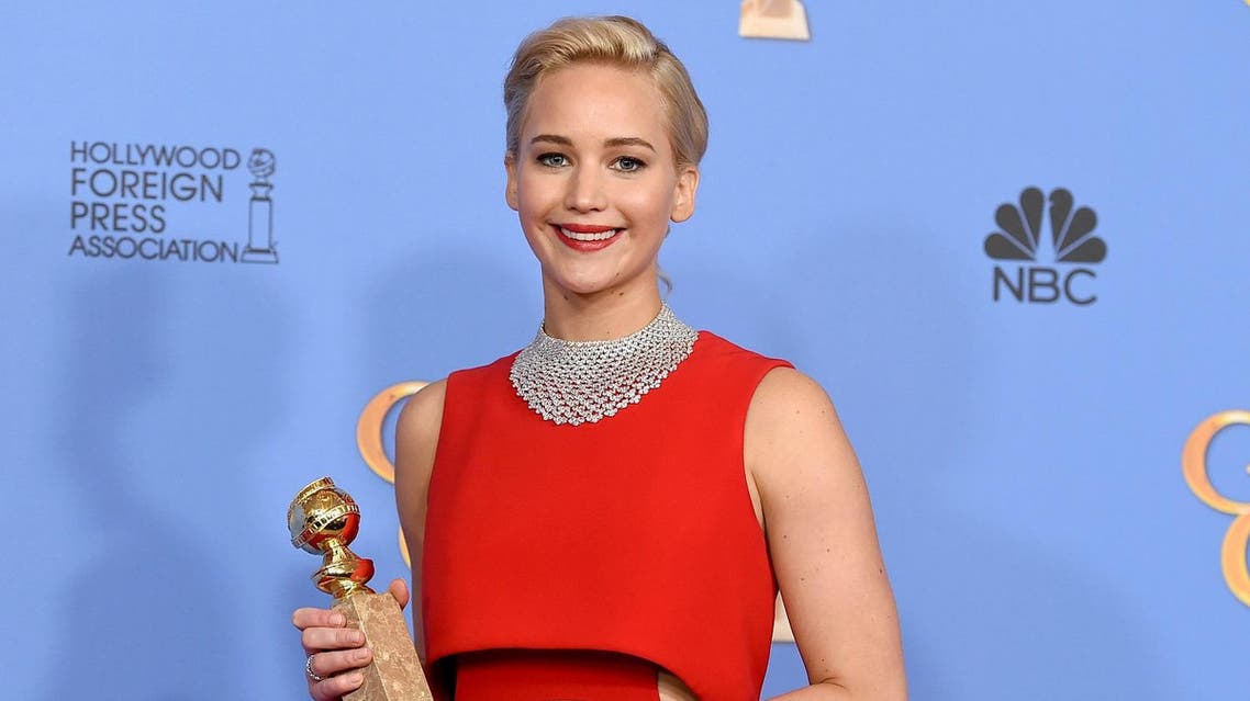 Jennifer Lawrence poses in the press room with the award for best performance by an actress in a motion picture - musical or comedy for “Joy” at the 73rd annual Golden Globe Awards. (AP)