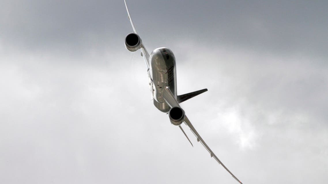 A Qatar Airways Boeing 787 Dreamliner flies during a flying display at the third day at the Farnborough International Airshow, in Farnborough, England, Wednesday, July 11, 2012. (AP)