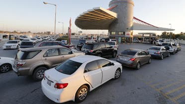 Drivers wait in line to fill their vehicles at a petrol station in Budaiya, Bahrain, January 11, 2016.  (Reuters)