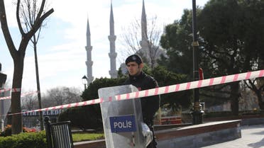 Police office secures area after an explosion near the Ottoman-era Sultanahmet mosque in Istanbul. (AP)