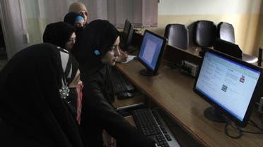  In this picture taken on Wednesday, Sept. 5, 2013, Pakistani university students try to access YouTube in Karachi, Pakistan. For almost a year, Pakistanis wanting to watch the video-sharing website YouTube have had to find other alternatives. The site has been banned since Sept. 17, 2012 after Pakistani officials acting in response outrage across the country over the airing of an anti-Islamic film blocked access to YouTube. (AP Photo/Shakil Adil)