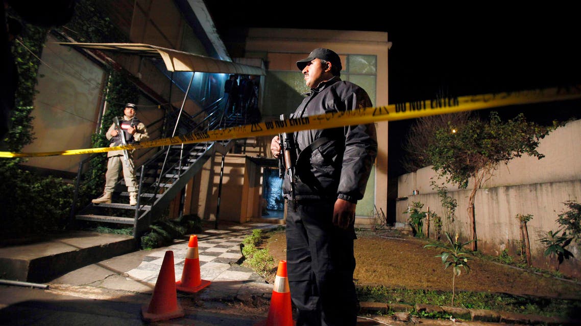 Pakistani troops stand at the site of firecracker attack on ARY news channel's office in Islamabad, Pakistan, Wednesday, Jan. 13, 2016. An unidentified man threw a firecracker at Pakistan’s independent ARY news channel in Islamabad wounding an employee. ARY said the attacker fled but left behind a leaflet purportedly from the Islamic State group, warning of more attacks against media that broadcast what it said were army’s biased claims in operations against militants. (AP Photo/Anjum Naveed)