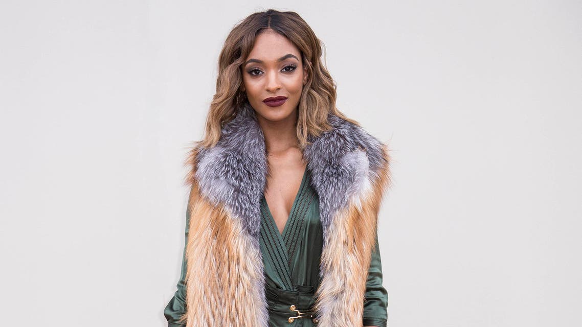 Jourdan Dunn poses for photographers upon arrival for the Men's Burberry Prorsum 2016 show, in Kensington Gardens, central London, Monday, Jan. 11, 2016. AP