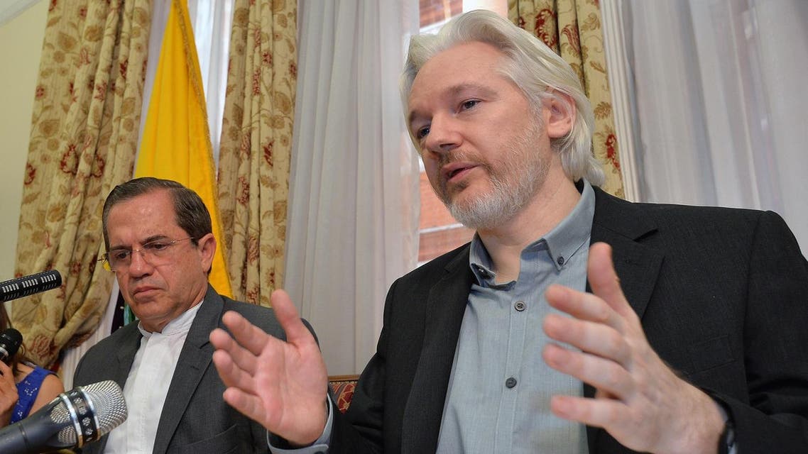 Ecuador's Foreign Minister Ricardo Patino, left, and WikiLeaks founder Julian Assange speak during a news conference inside the Ecuadorian Embassy in London. (AP)