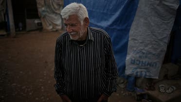 Ibrahim Mahmoud stands in Baharka refugee camp in Iraq’s northern Kurdish region. (AP)