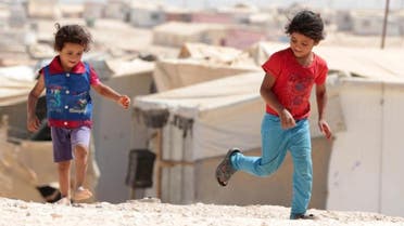 Young Syrian refugees play at the UN-run Zaatari camp, north east of the Jordanian capital Amman. (AFP)