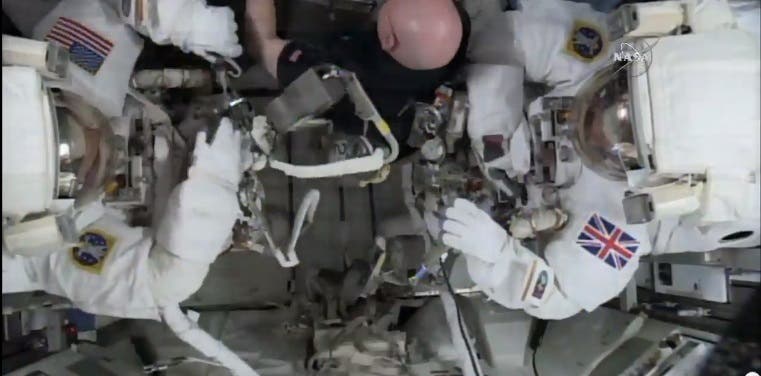 This photo taken from video provided by NASA shows astronaut Scott Kelly, center, help gather equipment for U.S. astronaut Tim Kopra, left, and British astronaut Tim Peake, as they prepare for a space walk at the International Space Station on Friday, Jan. 15, 2016. Peake will become the first Briton to walk in space when he ventures out of the International Space Station (ISS) to help repair a broken power unit. (NASA via AP)