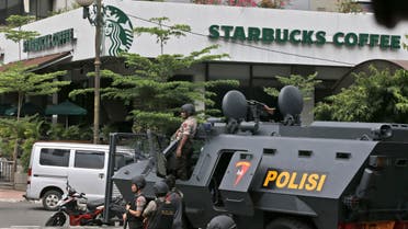 A police armored vehicle is parked outside a Starbucks cafe after an explosion in Jakarta, Indonesia Thursday, Jan. 14, 2016.  AP