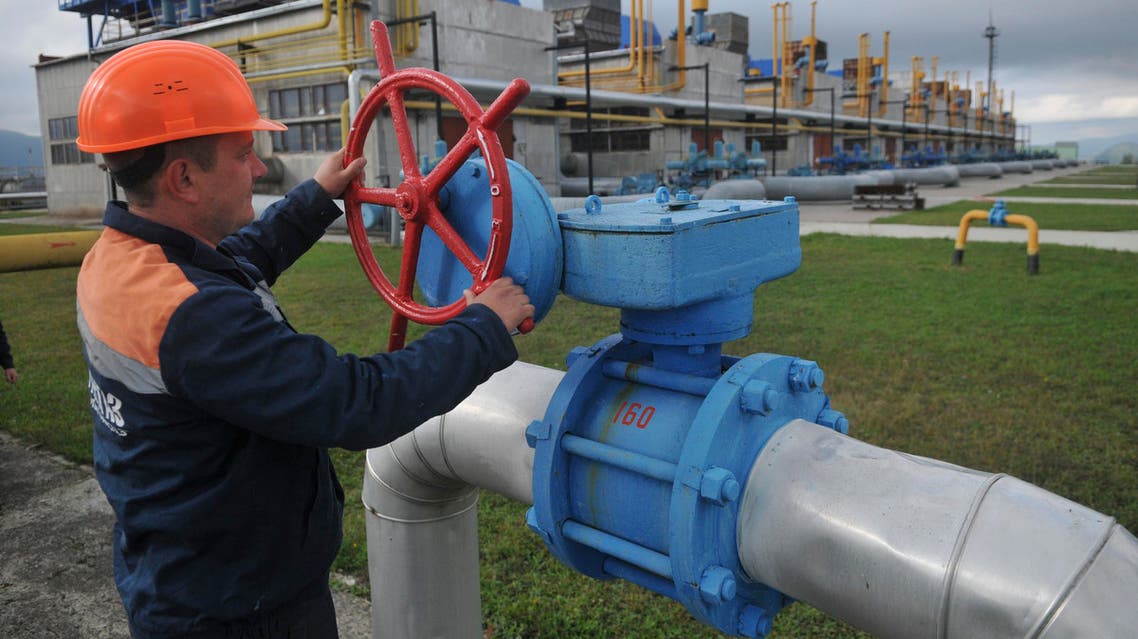 In this Wednesday, Oct. 7, 2015 file photo, a worker at a Ukrainian gas station Volovets in western Ukraine controls a valve. AP