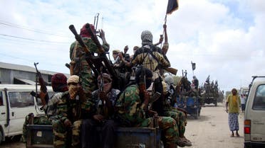 In this photo of Thursaday, Oct.21, 2010, Al-Shabaab fighters display weopons as they conduct military exercises in northern Mogadishu, Somalia AP
