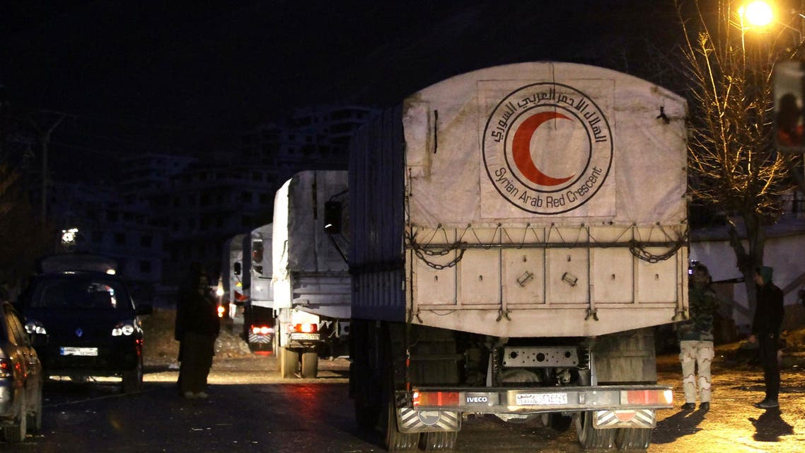  Convoys of aid from the Syrian Arab Red Crescent enters the besieged rebel-held Syrian town of Madaya on January 14, 2016. AFP