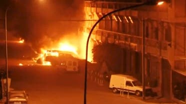 A view shows vehicles on fire outside Splendid Hotel in Ouagadougou, Burkina Faso in this still image taken from a video January 15, 2016, during a siege by Islamist gunmen. REUTERS