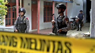Armed police stand in front a house whose owner was arrested during a raid in the Langgen village in Tegal, Indonesia Central Java, January 15, 2016 in this photo taken by Antara Foto. reuters