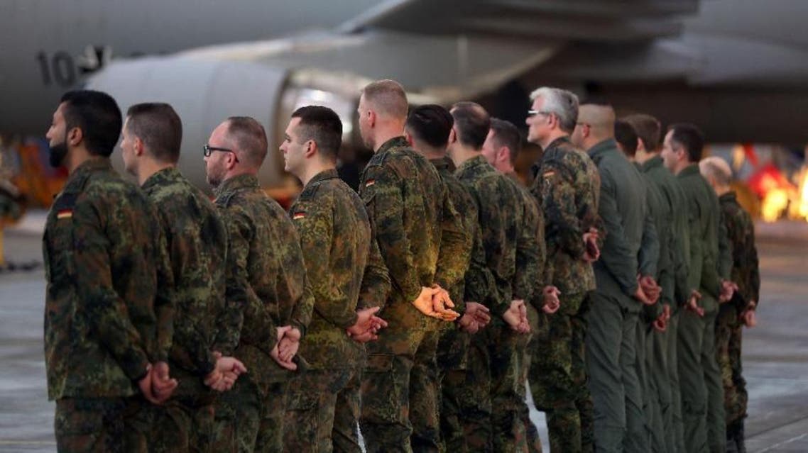 Soldiers of the German air force prepare to enter an A310 MRT aerial refuelling jet before it takes off from the Cologne Wahn base near Cologne, western Germany, December 10, 2015 (AFP)
